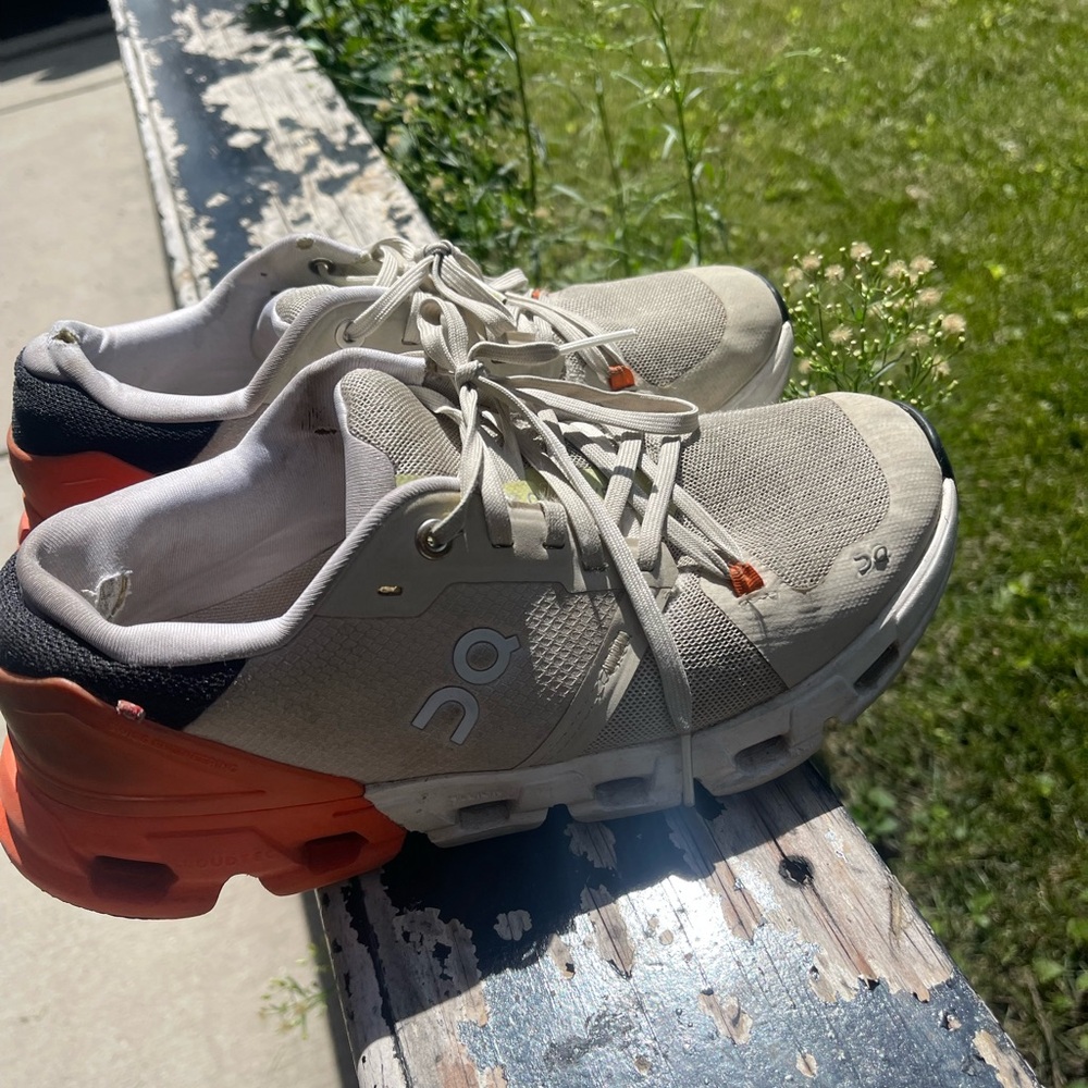 On Running Cream and Orange Athletic Shoes